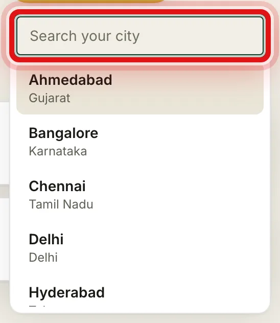 The city search box open, listing cities like Ahmedabad, Bangalore and Chennai
