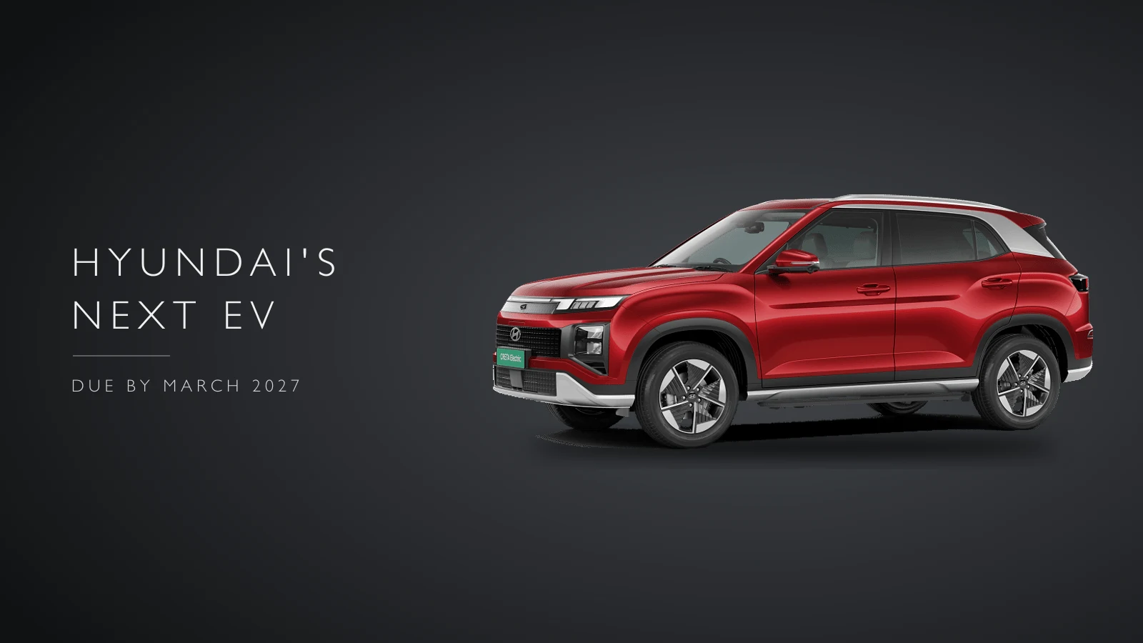 Red Hyundai Creta Electric seen from the front three-quarter on a dark background