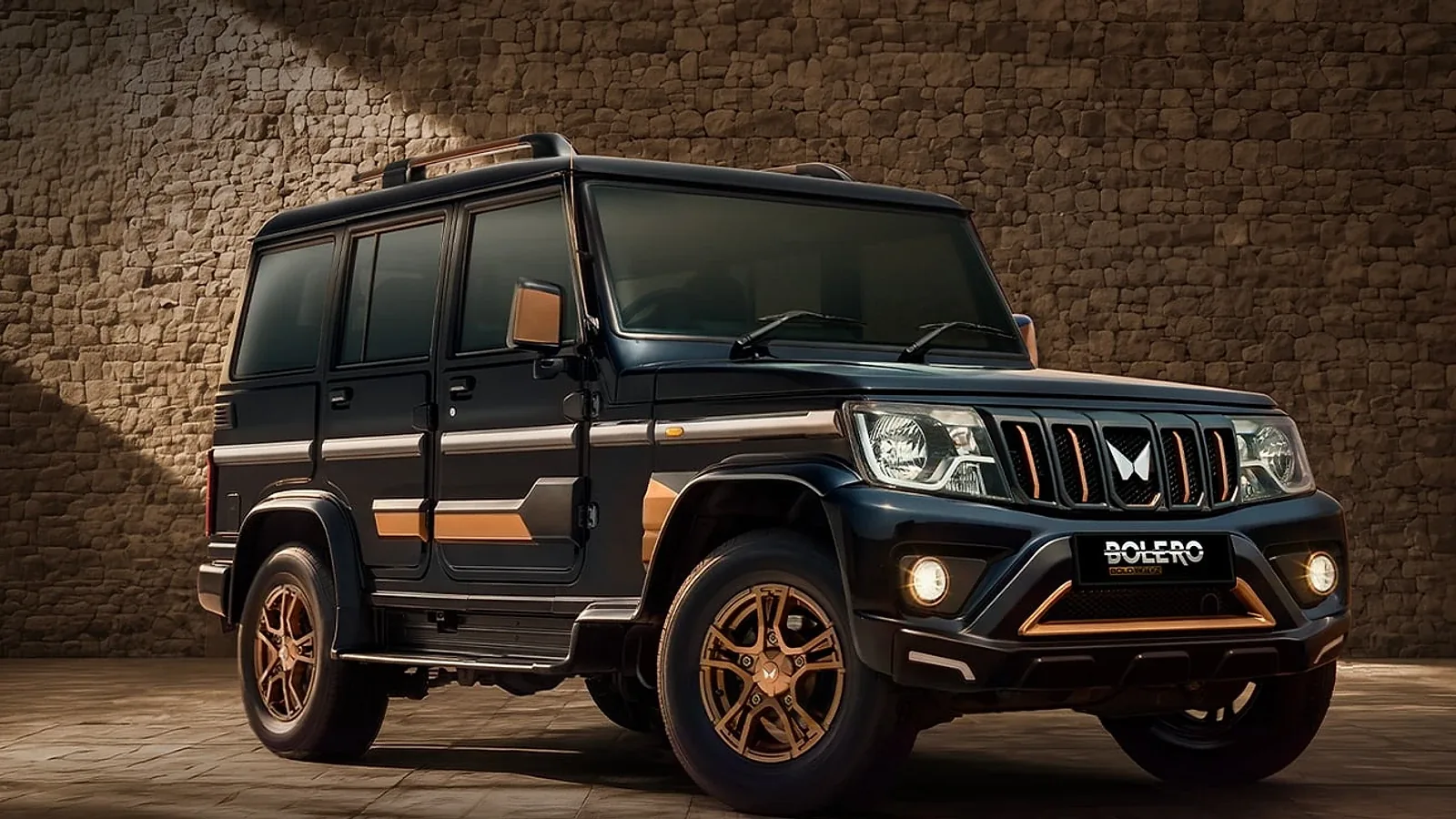 Mahindra Bolero Bold Edition in black with bronze grille accents, bronze alloy wheels and bronze side cladding